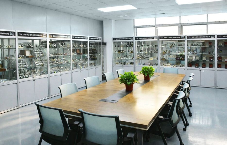 The sample room, with the range in wall cabinets around a meeting table.